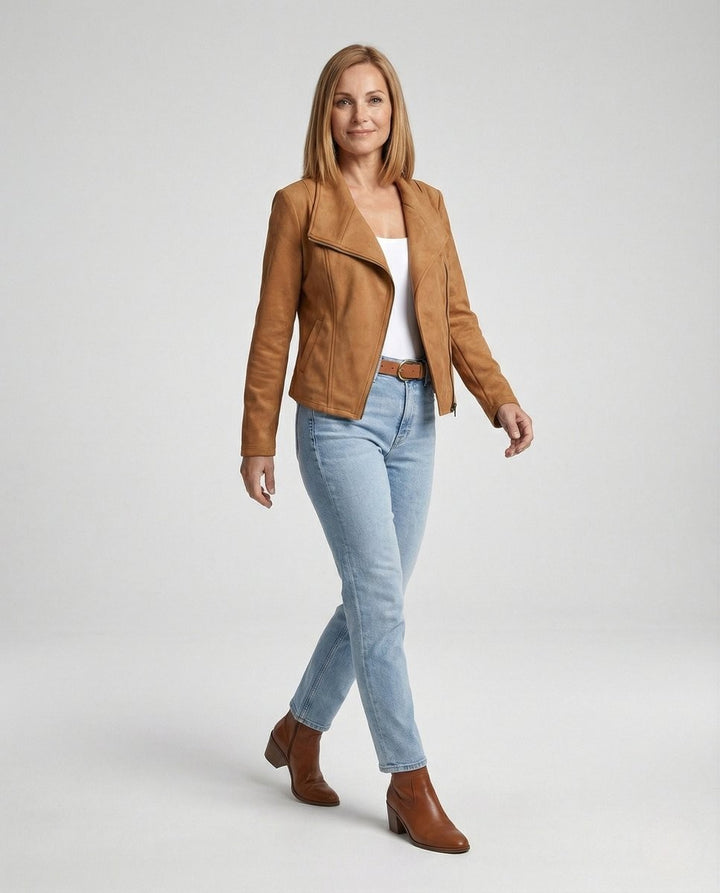 Woman walking in a camel suede-look moto jacket with light wash jeans