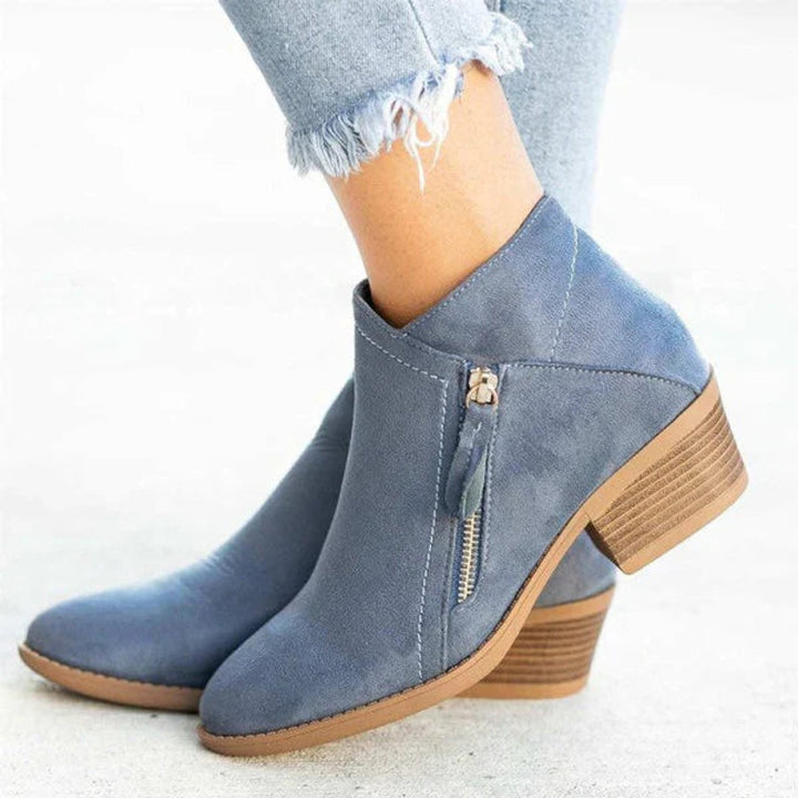 Dusty blue suede ankle boot with side zipper and stacked block heel