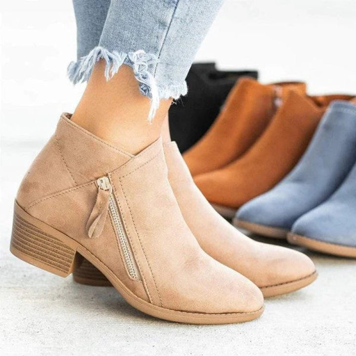 Camel suede ankle boots shown alongside black and blue color variants