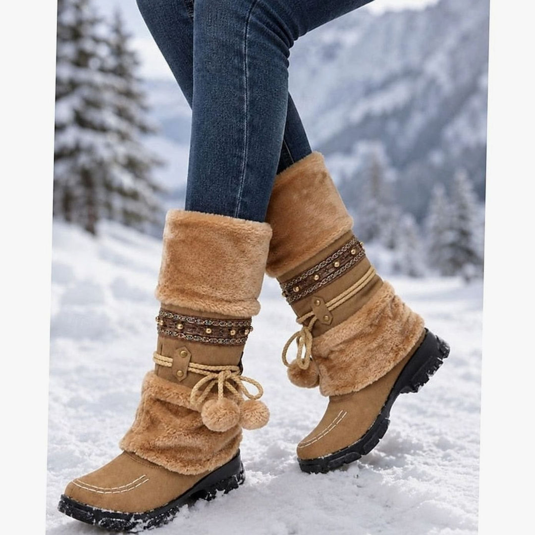 woman walking in snow wearing tan faux-fur cuff mid-calf snow boots