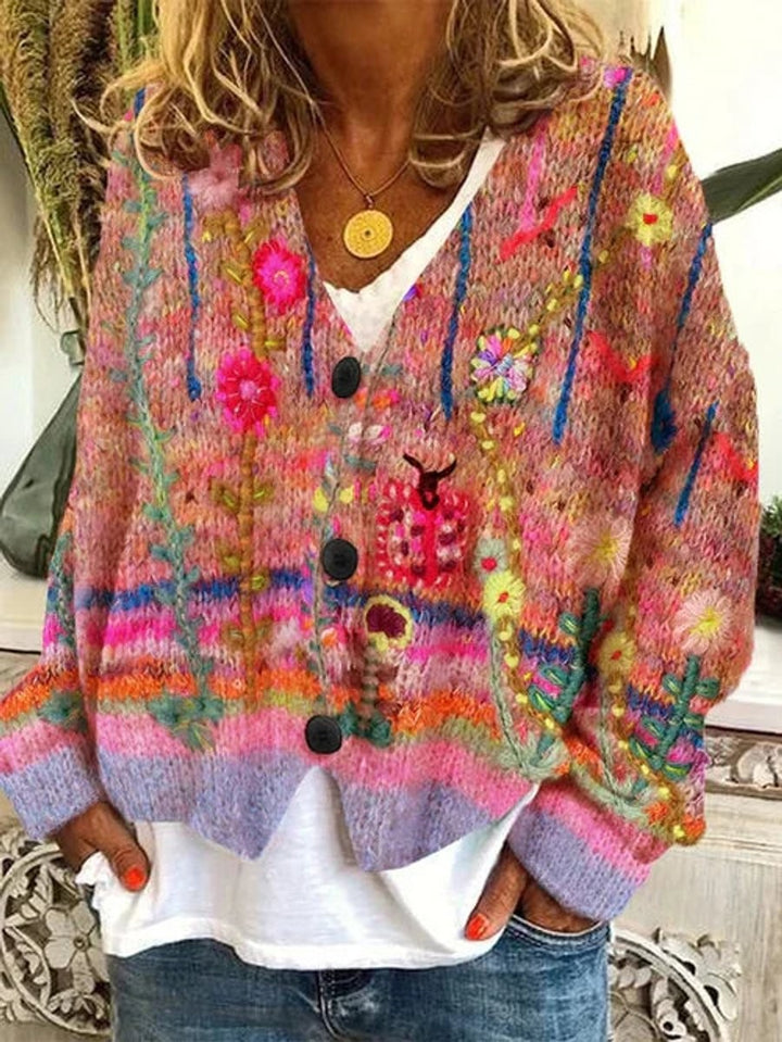 pink multicolor floral knit cardigan with black button closures and V-neckline