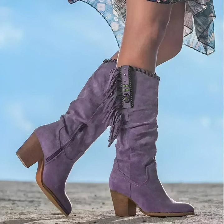 lavender suede knee-high boots featuring fringe and stacked block heel