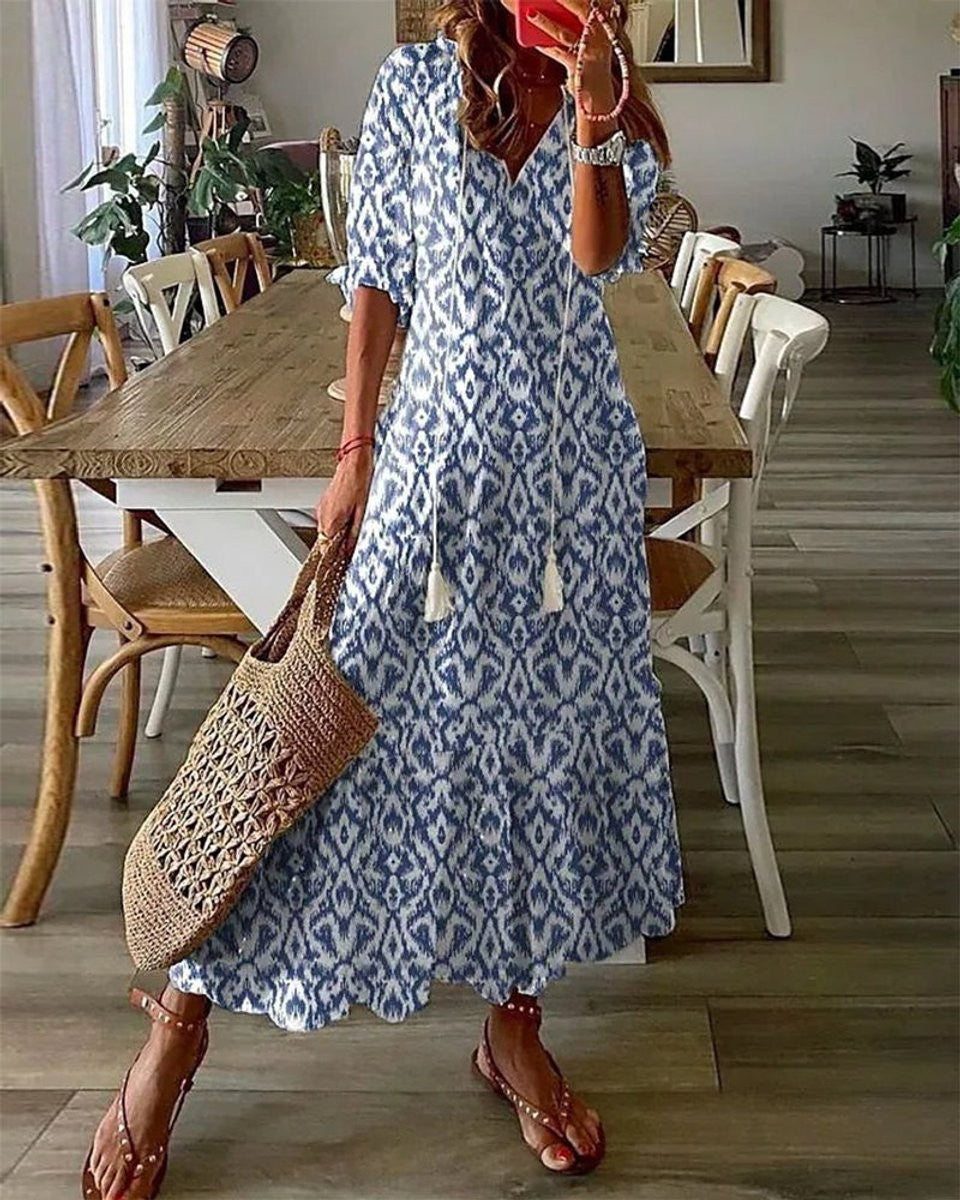Blue and white ikat print maxi dress with tasseled V-neck and half sleeves