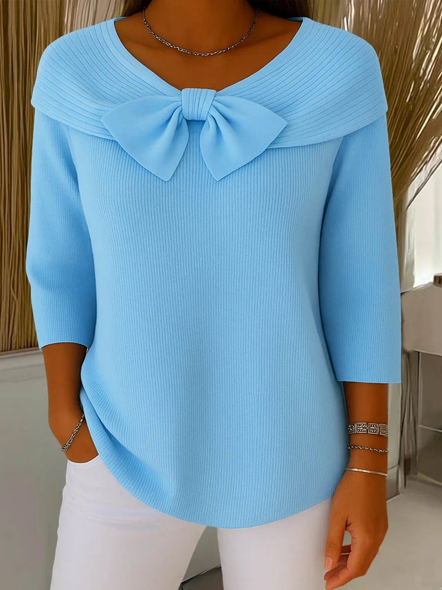 Light blue ribbed knit sweater with bow detail and off-shoulder collar