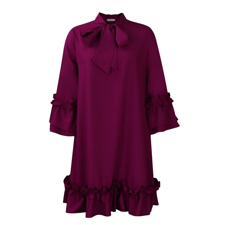magenta bow-neck tunic dress with ruffled sleeves and hem, flat lay