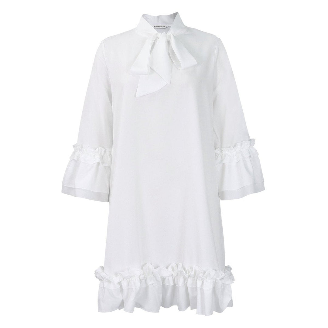 white tie-neck tunic dress with ruffled cuffs and hemline, flat lay