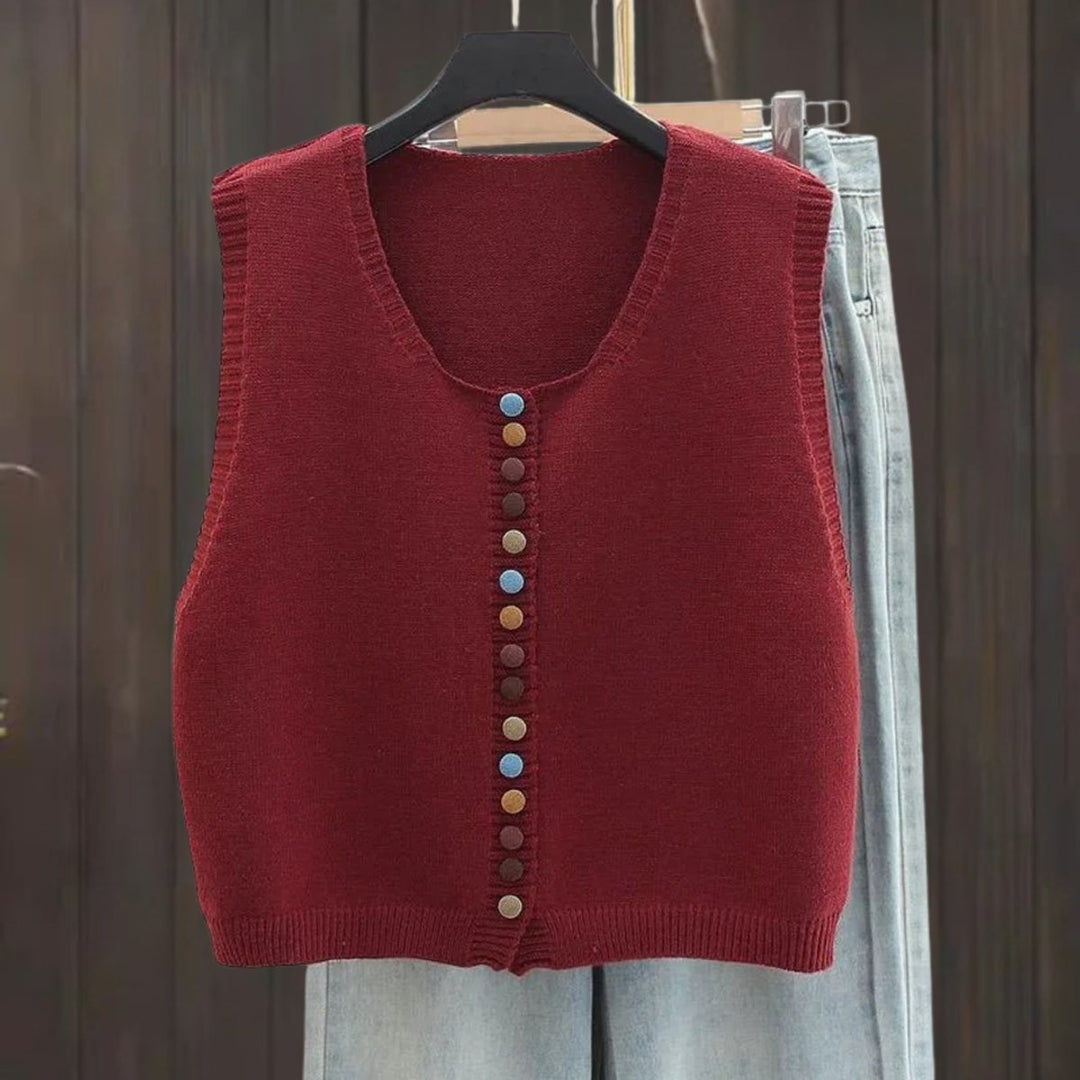 Wine red sleeveless cardigan vest featuring multicolor buttons, close-up view