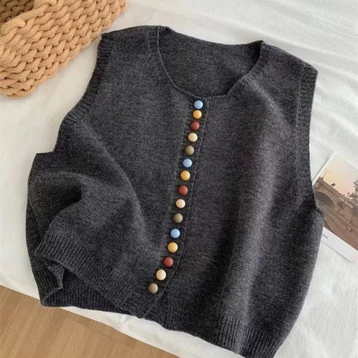Charcoal knit vest featuring colorful button front, flat lay view