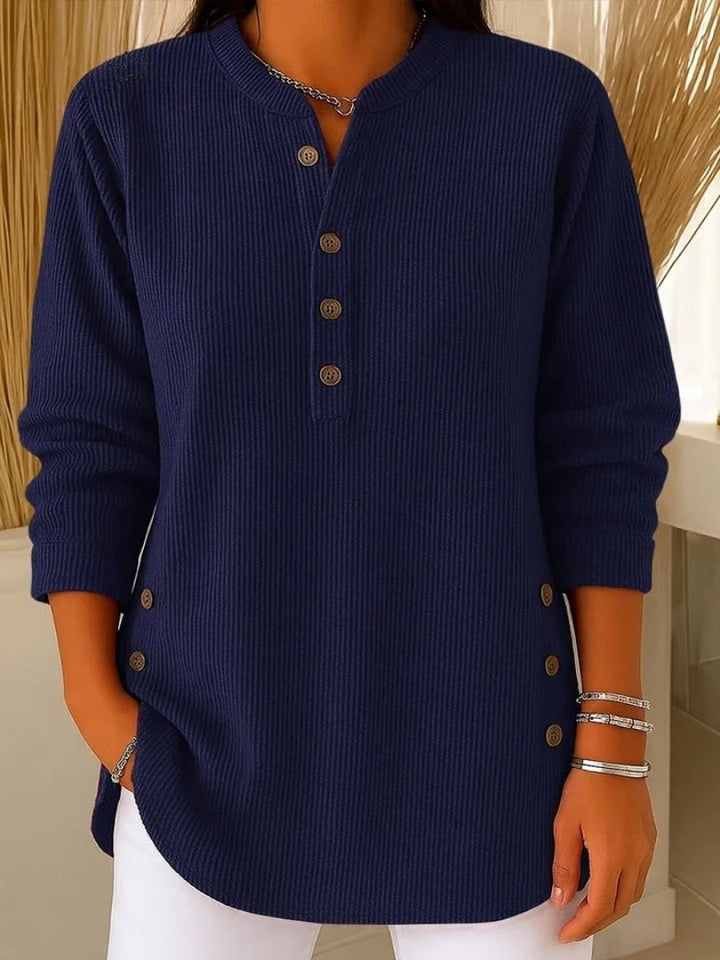 navy blue ribbed knit henley top featuring button placket and side buttons