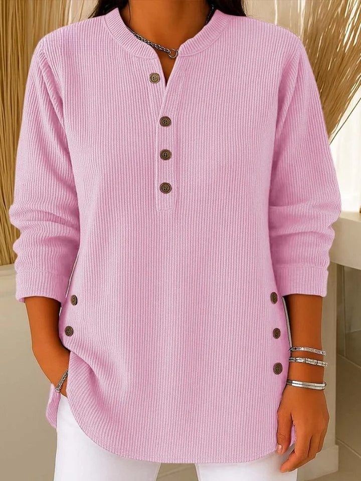 pink ribbed knit long sleeve top with button detail and curved hem