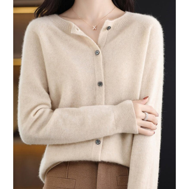 Cream ivory cashmere cardigan sweater with button closure, close-up