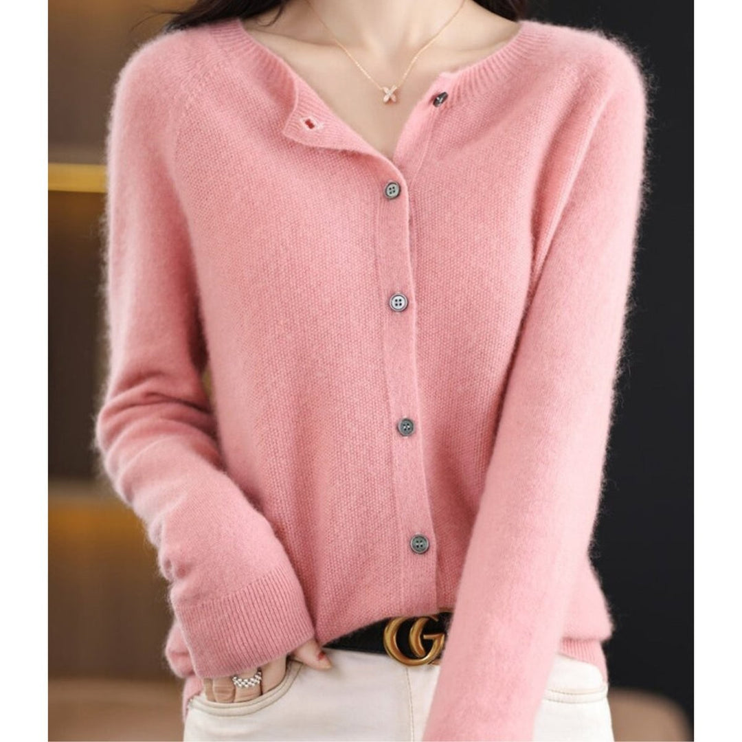 Blush pink knit cardigan sweater with button front, close-up view