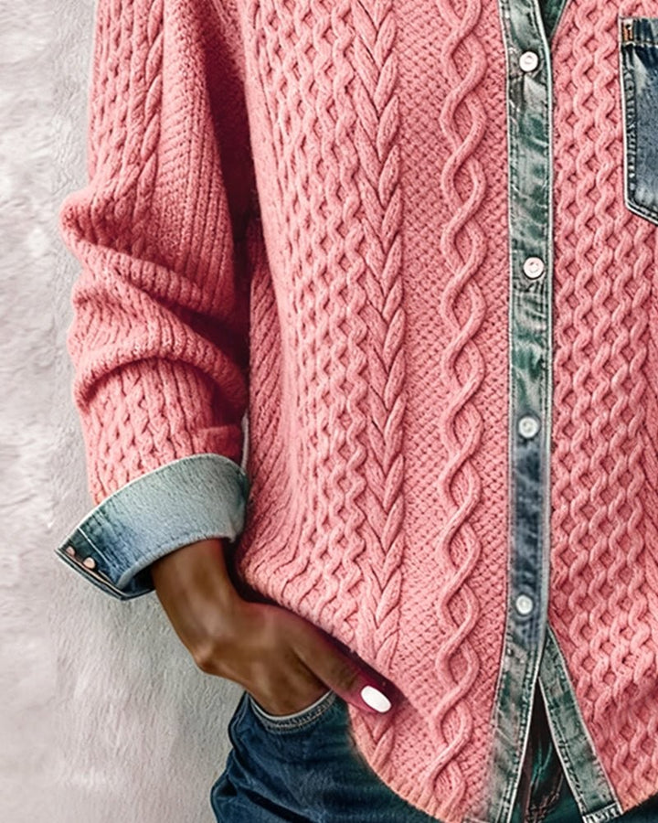 Pink cable-knit button-down shirt showing denim placket and cuffed sleeve