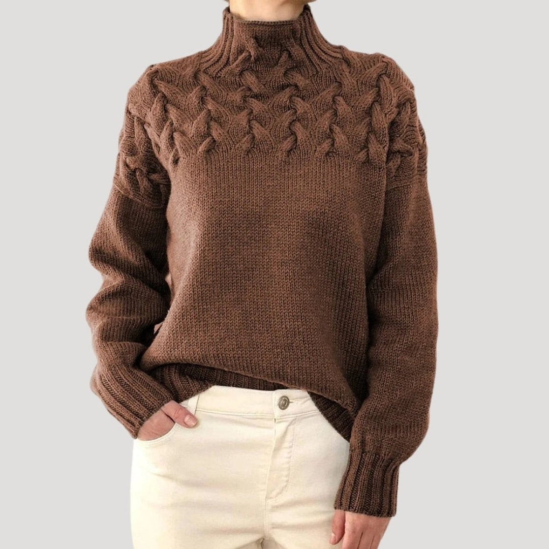 Brown cable knit turtleneck sweater with cozy braided yoke pattern