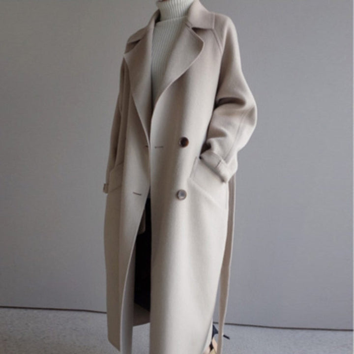 cream oversized wool coat with turtleneck sweater underneath