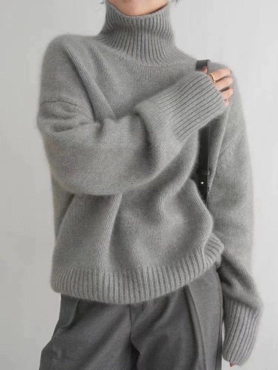 Gray oversized turtleneck sweater styled with matching wide-leg trousers