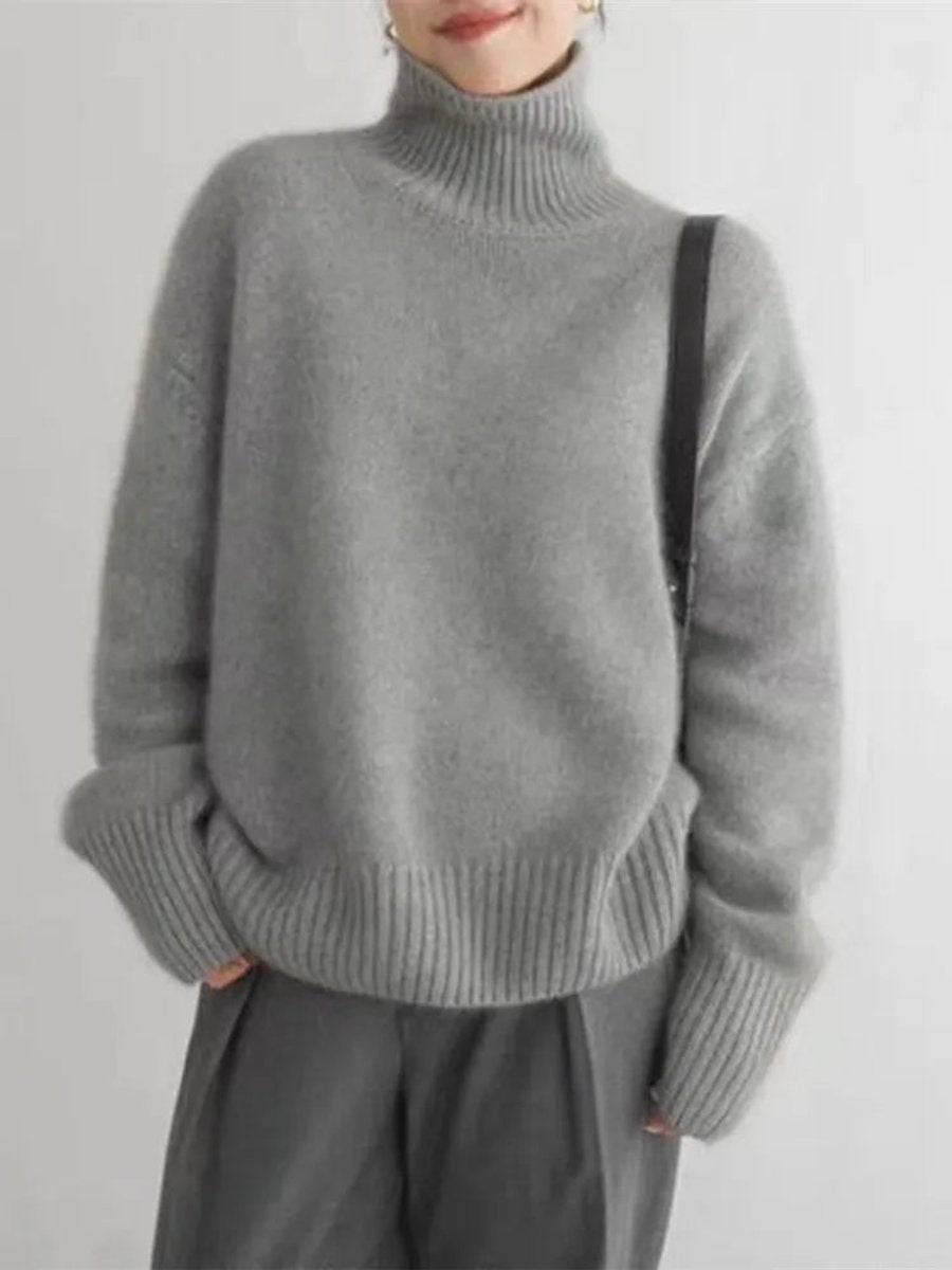 Heather gray knit turtleneck sweater with dropped shoulders and ribbed hem