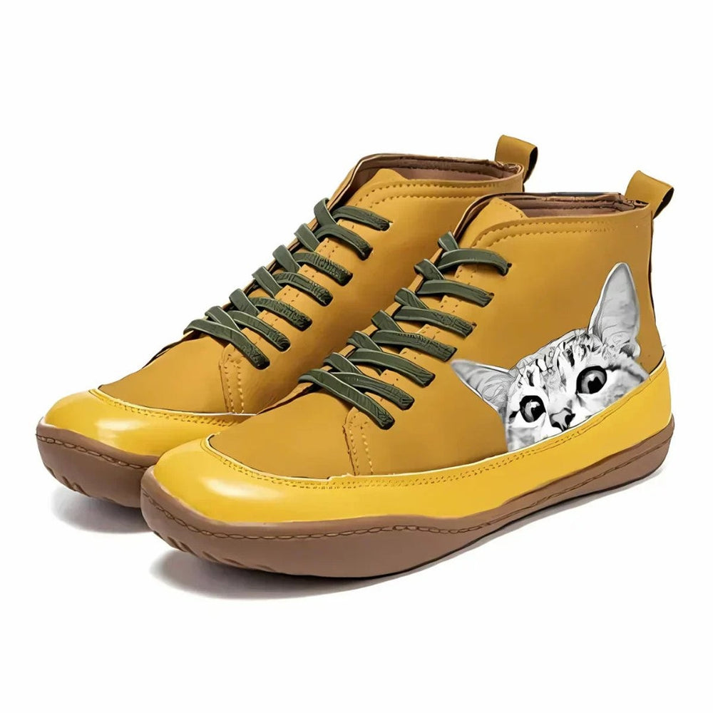 Mustard yellow lace-up ankle boots featuring printed cat graphic
