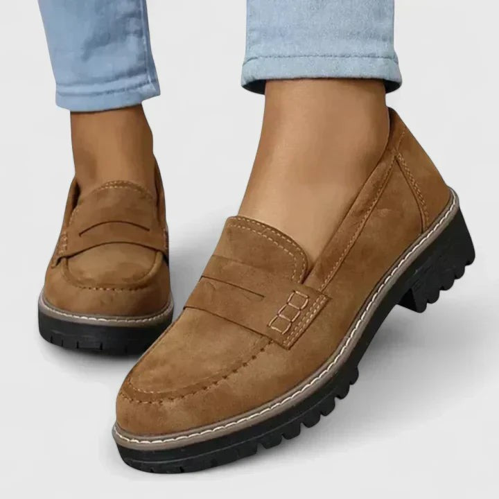 tan suede penny loafers with chunky platform sole and moc toe stitching