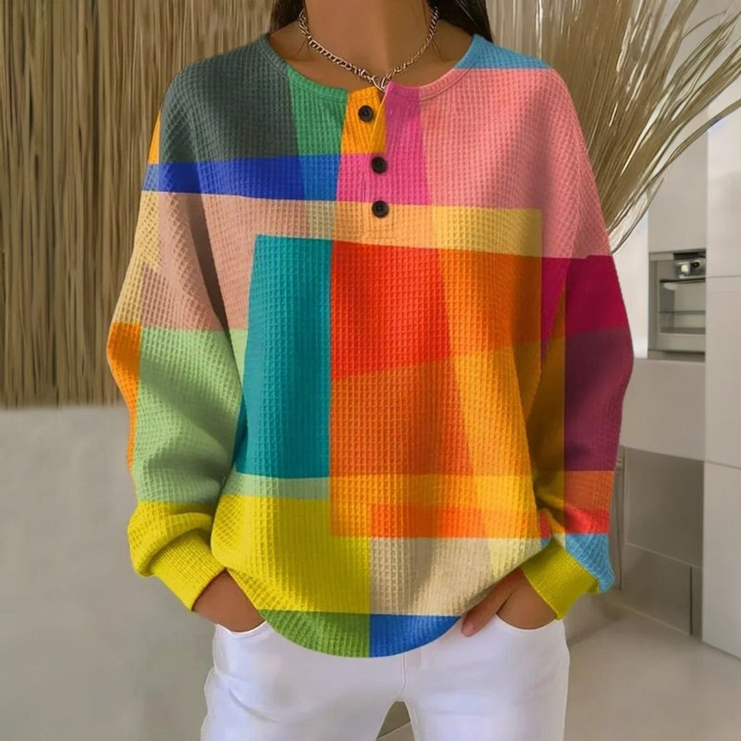 Multicolor waffle-knit Henley top featuring geometric color-block pattern and buttons