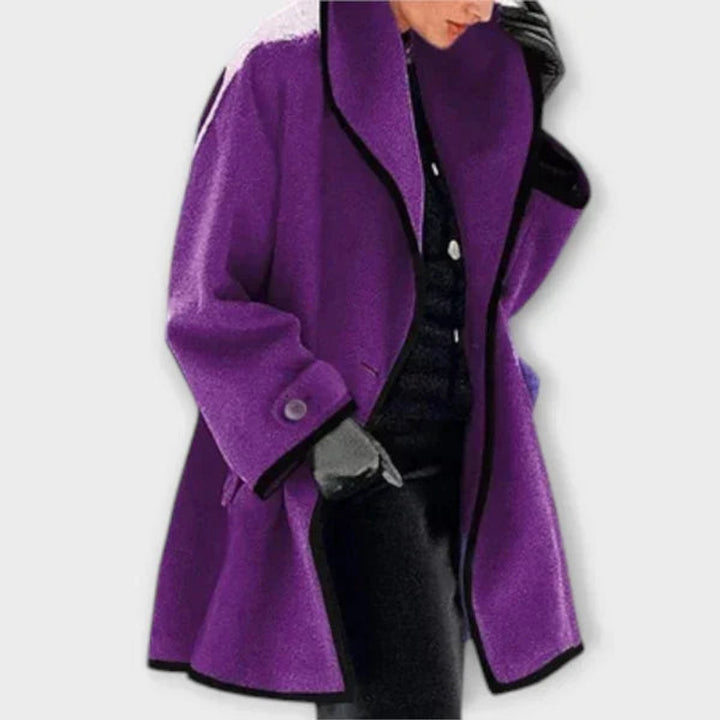 Purple swing coat with black contrast trim and oversized draped sleeves