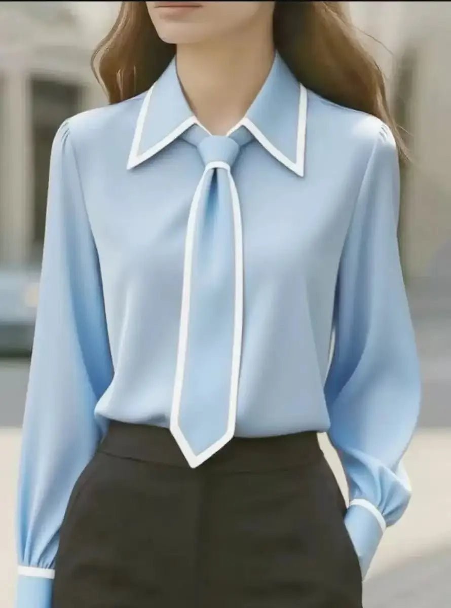 Light blue button-up blouse with white piping and removable tie