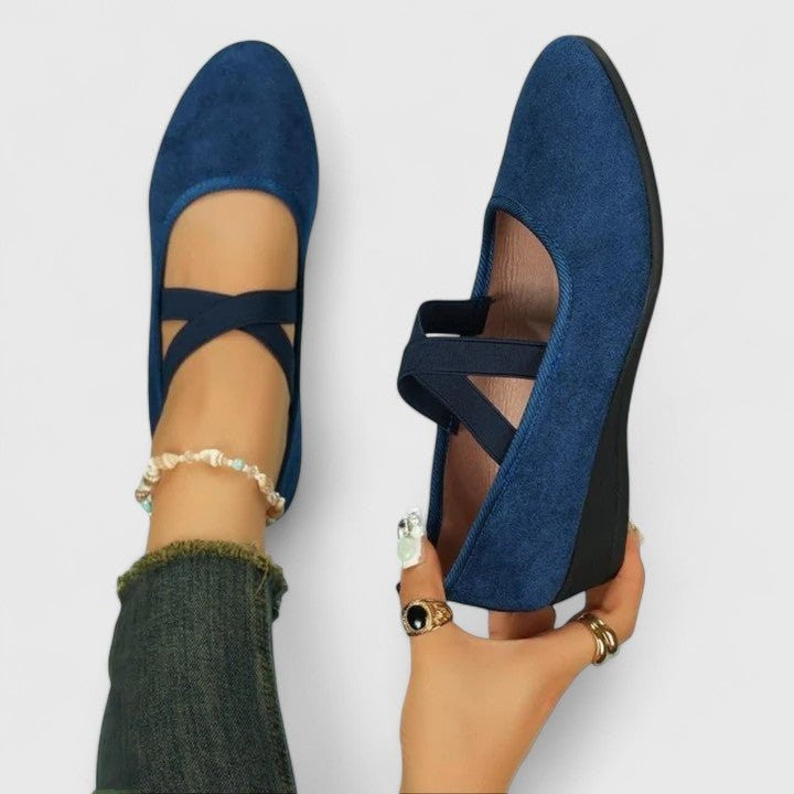 navy blue suede wedge flats featuring crossover elastic straps
