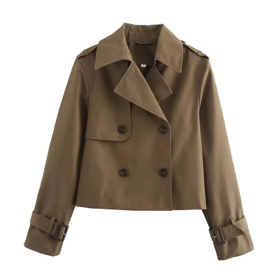 Brown cropped double-breasted trench coat with notched lapel and buckle cuffs