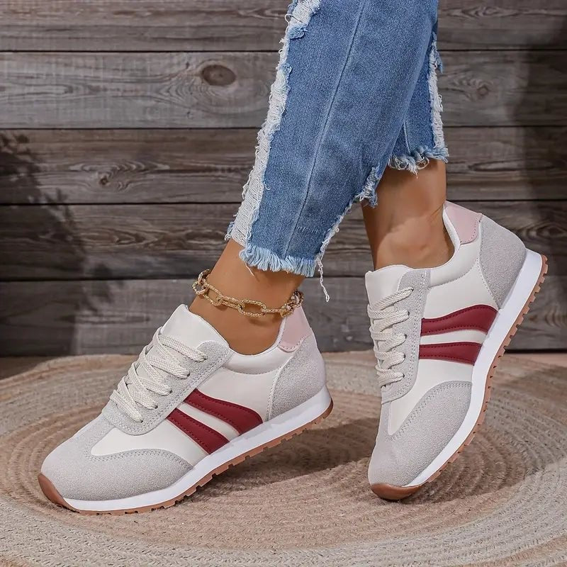Gray suede sneakers with burgundy stripes and pink heel accent