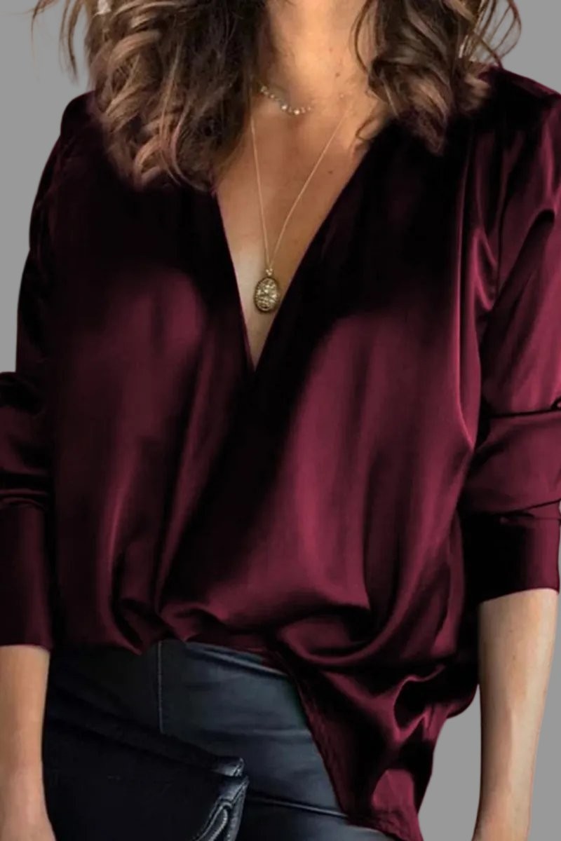 Burgundy satin blouse featuring deep V-neck and draped front