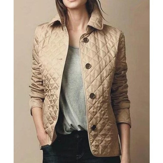 Beige diamond-quilted button-through jacket with tailored collar and dark buttons