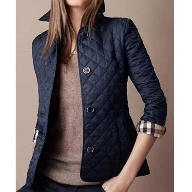 Navy diamond-quilted tailored jacket with plaid cuff detail and button closure