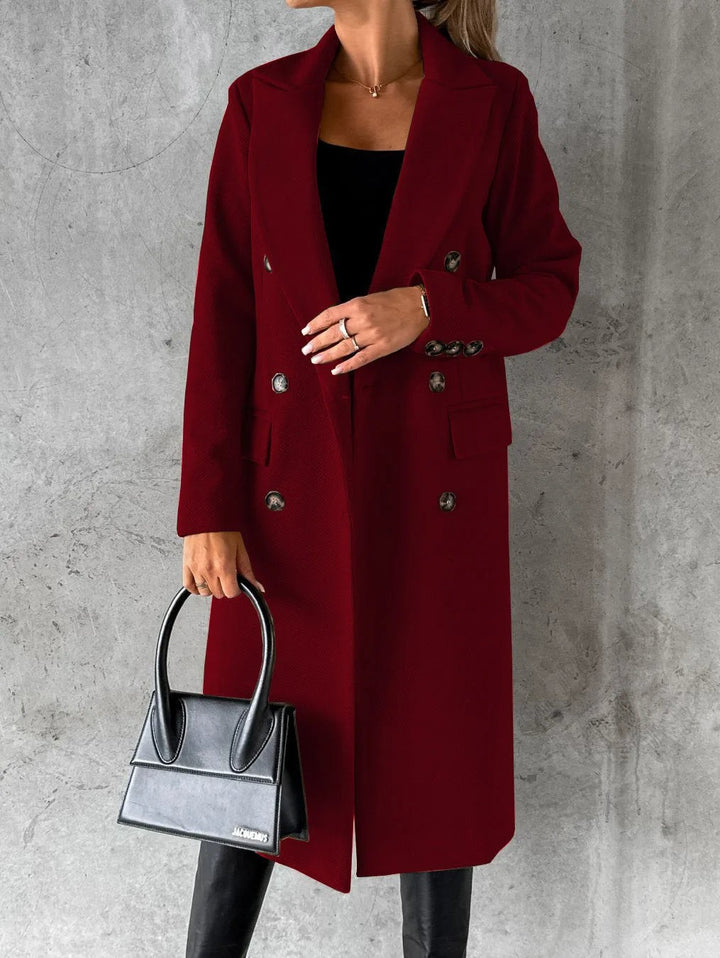 burgundy double-breasted longline coat styled with black handbag