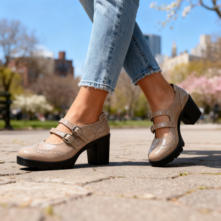 Taupe patent double-strap Mary Jane chunky heels with wingtip brogue perforations