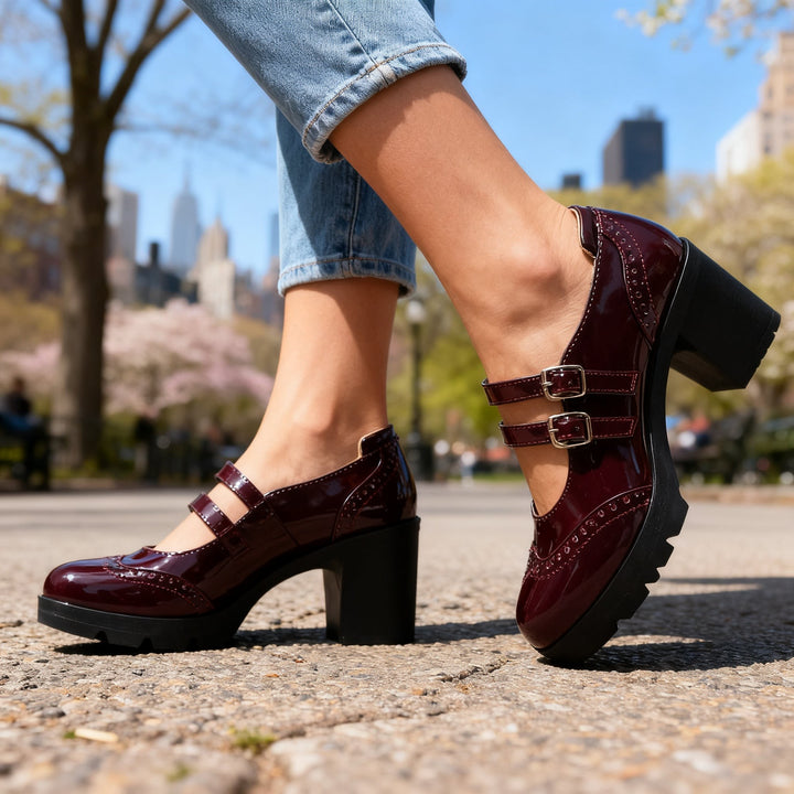 Burgundy patent double-strap Mary Jane platform pumps with block heel outdoors