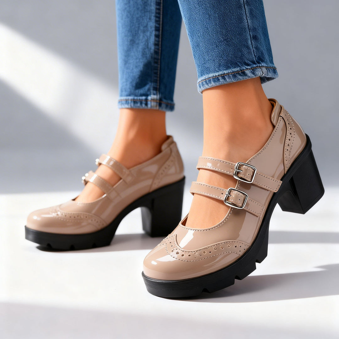 Taupe patent Mary Jane platform heels with double buckle straps and brogue trim