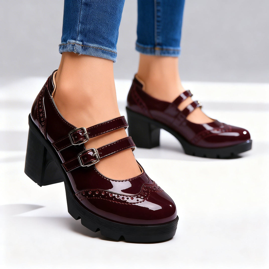 Burgundy patent double-strap Mary Jane pumps with chunky platform heel, studio shot