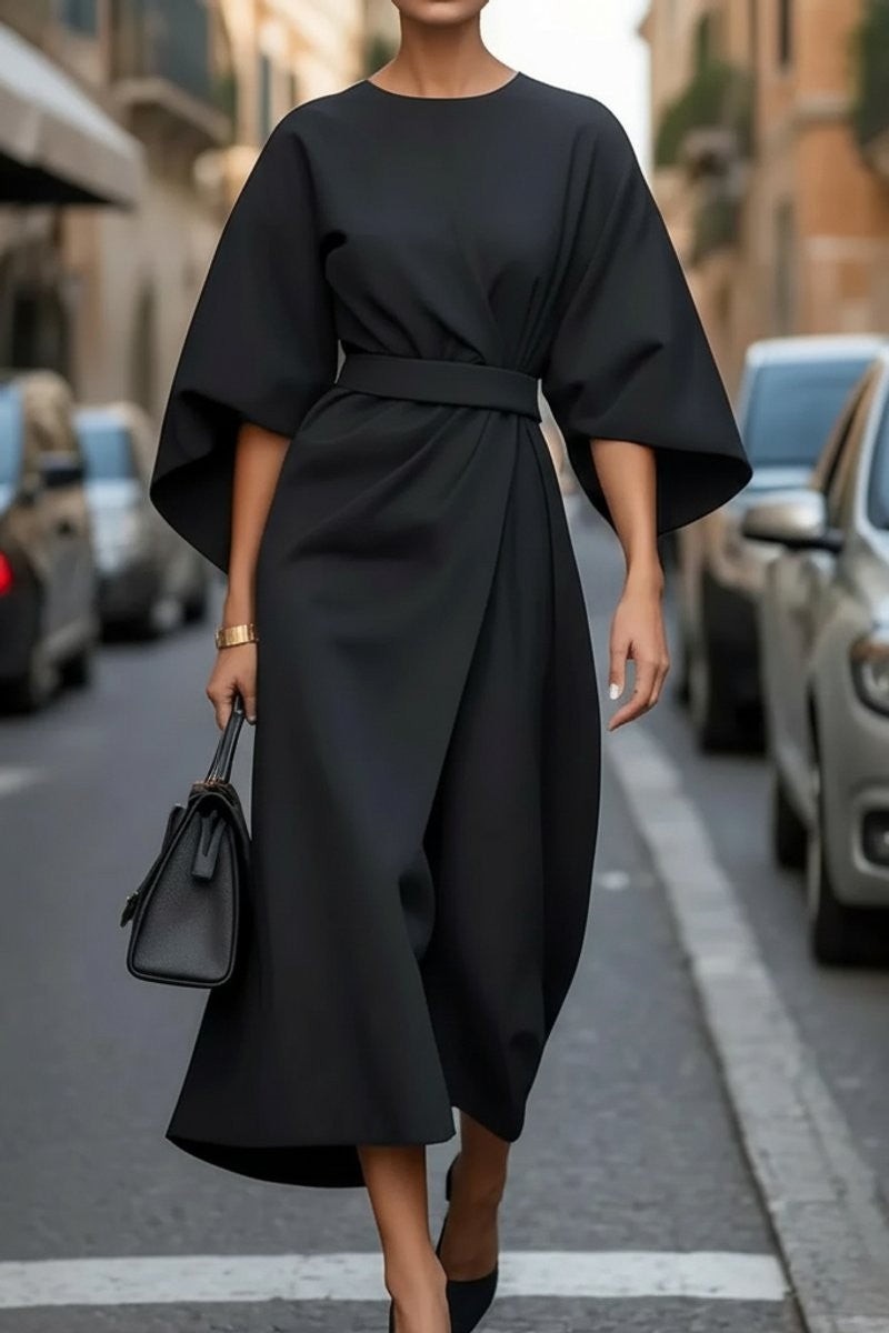Black cape-sleeve midi dress with belted waist and draped wrap skirt