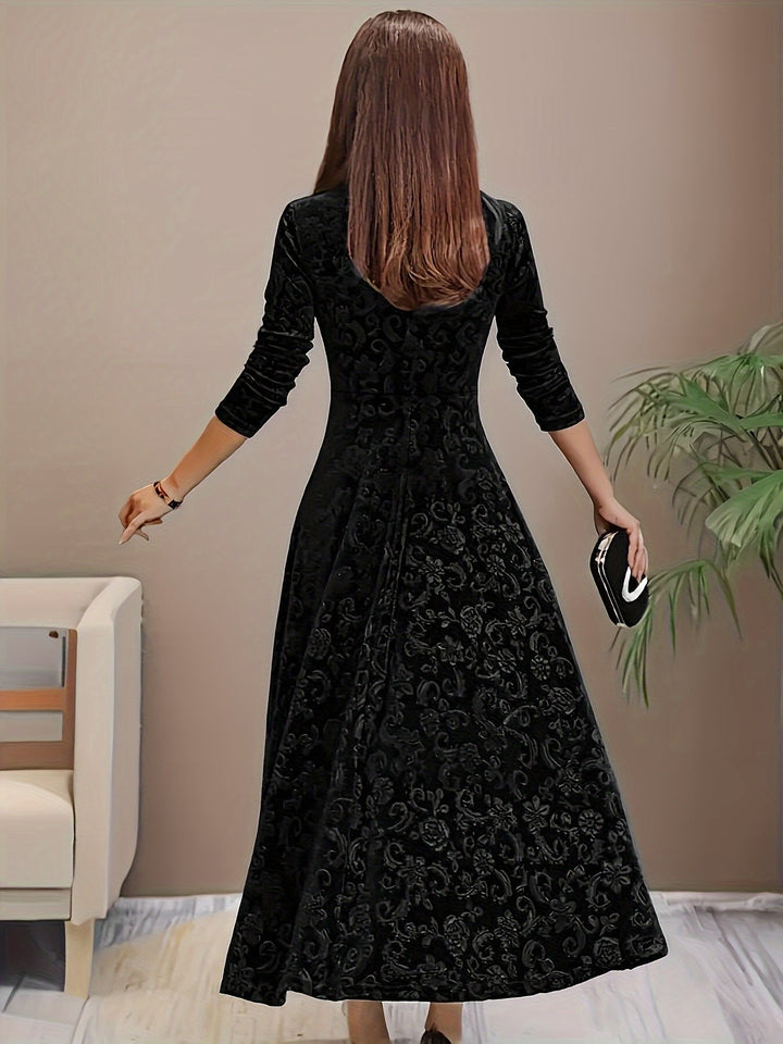 black velvet A-line midi dress, floral embossed pattern shown from back