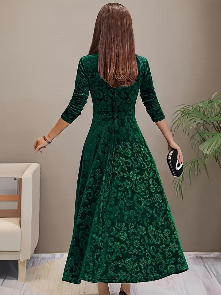 emerald green velvet A-line midi dress, floral texture shown from back
