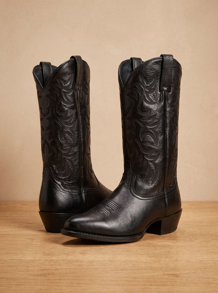 Pair of black leather cowboy boots with pointed toe and stitched shaft detail