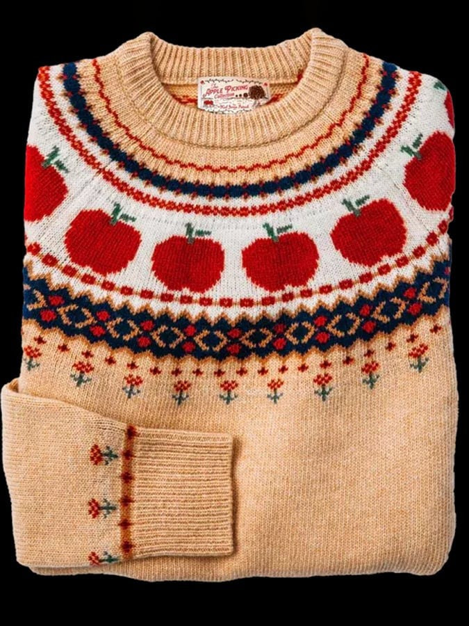 Tan wool crew-neck sweater with red apple and Fair Isle yoke pattern