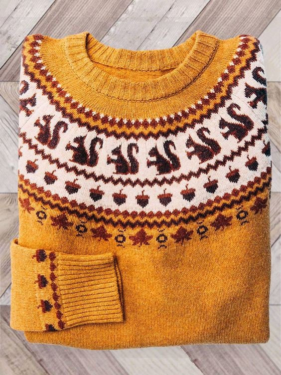 Mustard yellow crew-neck sweater with knit squirrel and acorn design
