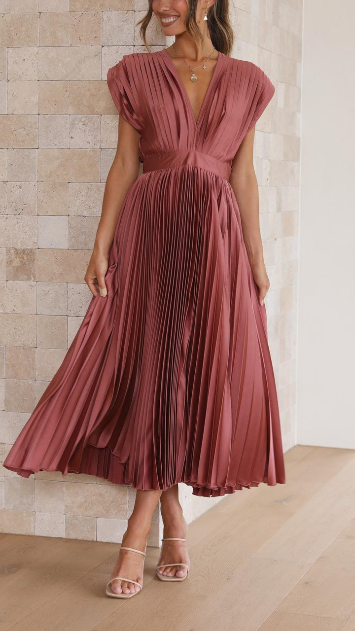 Front view of pleated satin dress in rusty rose with cinched waist