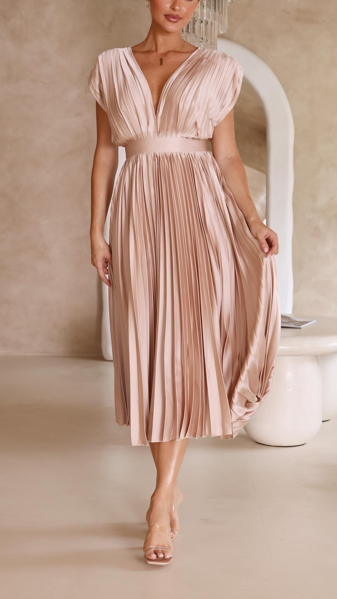 Blush pink pleated satin dress with deep V-neck and cap sleeves