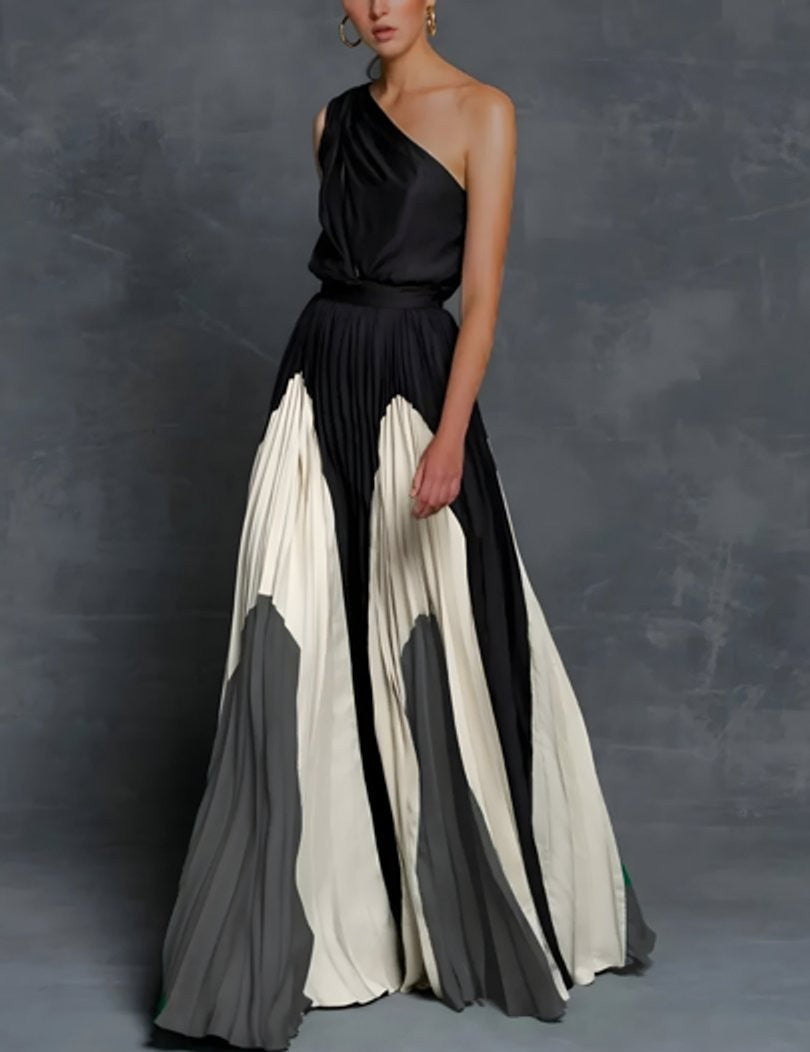 One-shoulder pleated maxi dress with black, ivory, and gray color-block skirt
