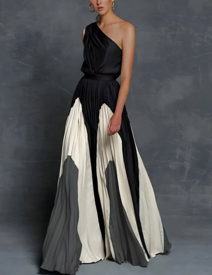 One-shoulder pleated maxi dress with black, ivory, and gray color-block skirt