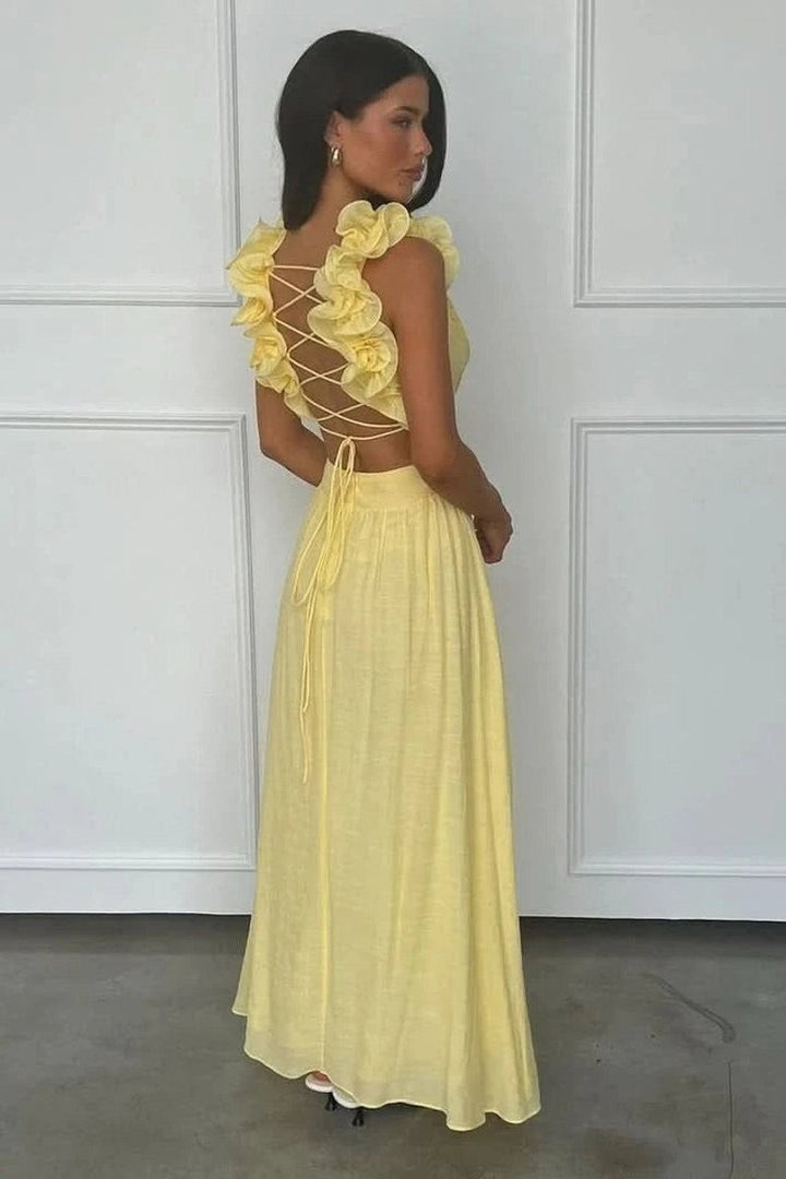 back view of yellow maxi dress with lace-up open back and ruffled straps