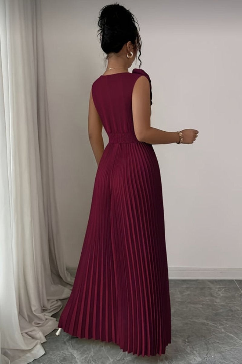 back view of burgundy pleated maxi dress with sleeveless bodice and cinched waist