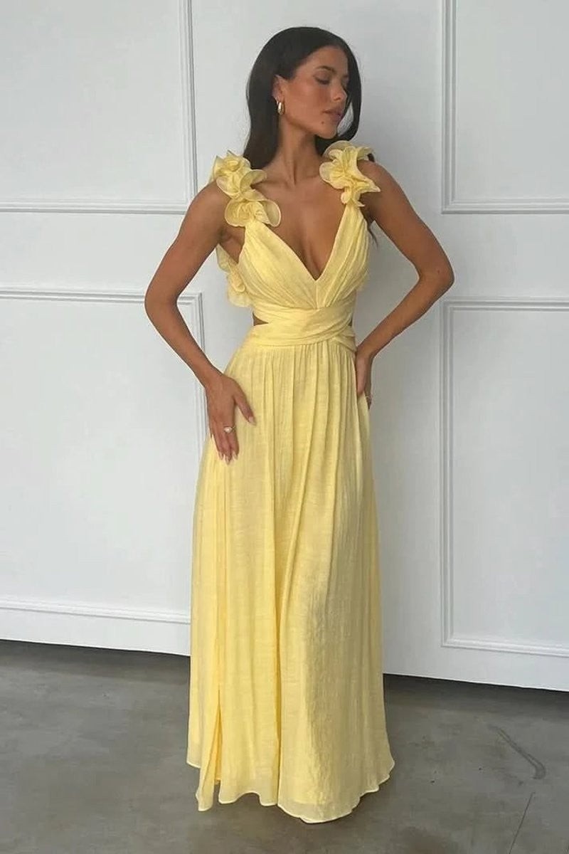 yellow V-neck maxi dress featuring floral shoulder straps and flowing skirt